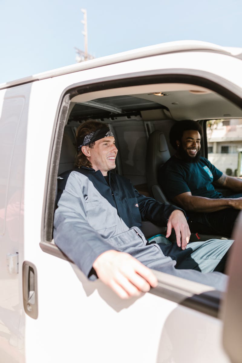 KC Plumbing Works crew with service van